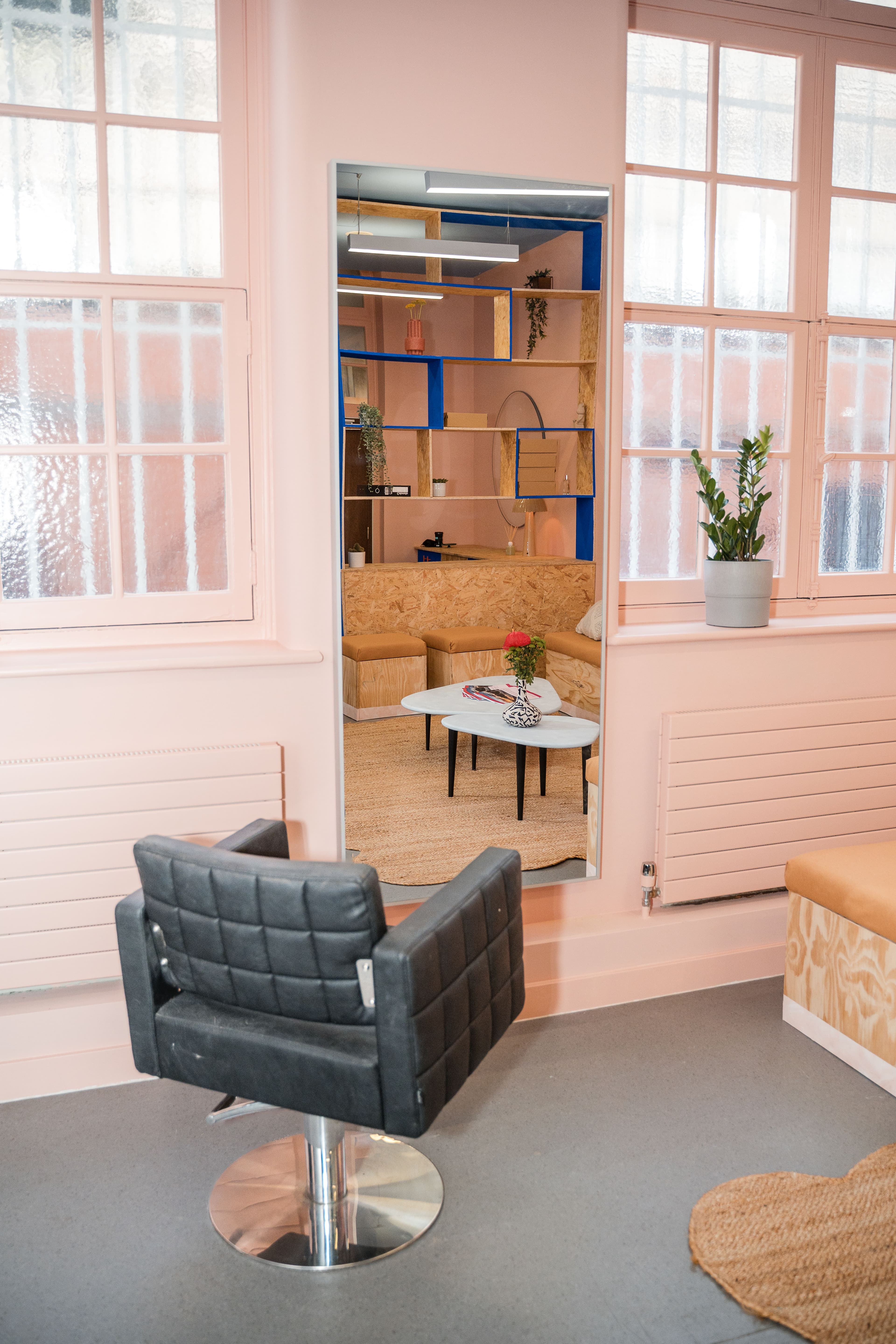 Hairdressing appointments take place in this space so a proper chair and mirror were sourced and installed