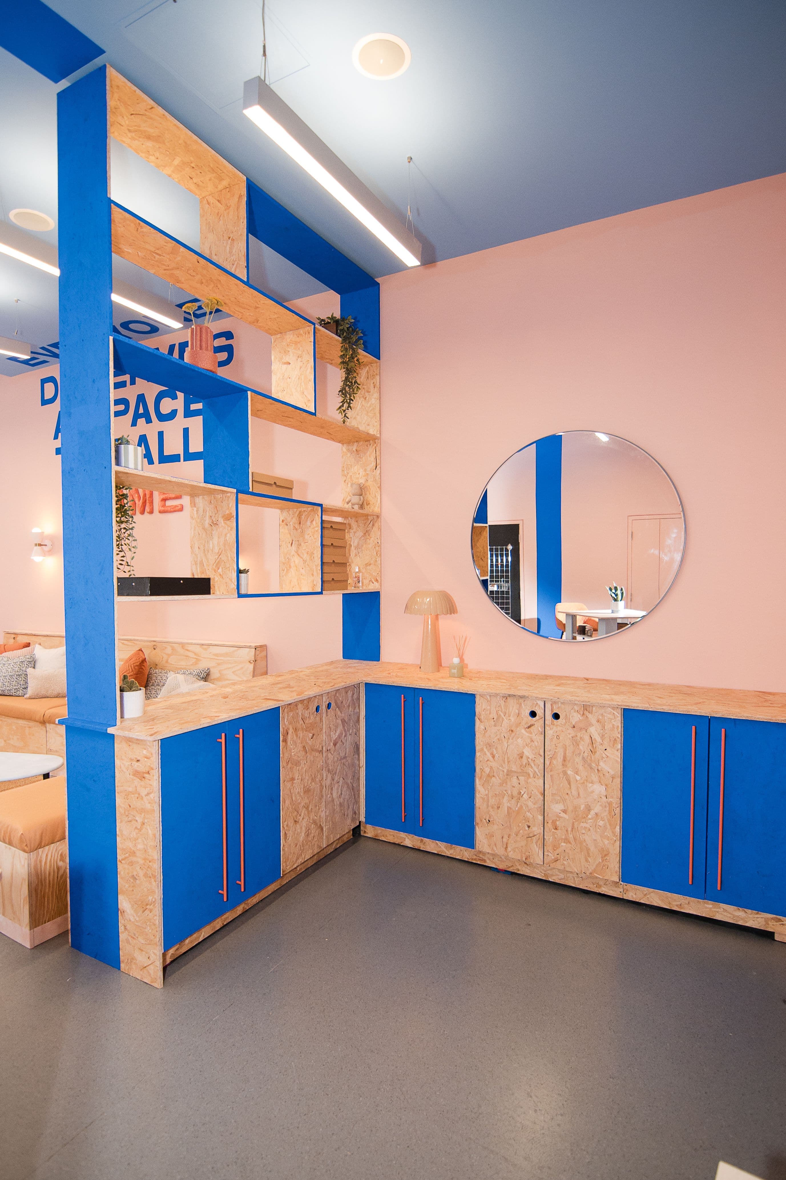 The entrance to the group workshop room with a storage divider, designed by Duran