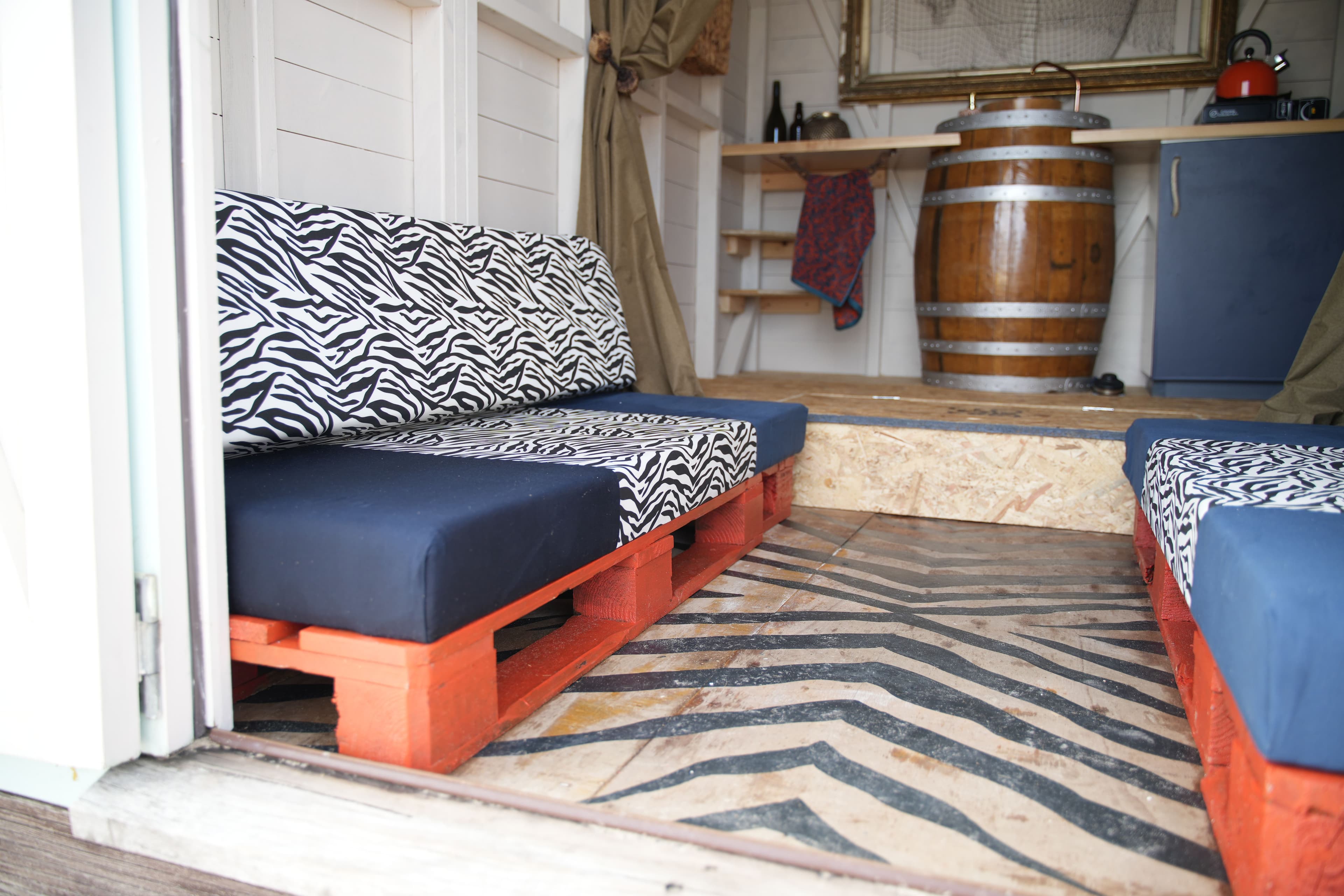 A closeup of the seating area 'conversation pit' enhanced by the false floor at the back.