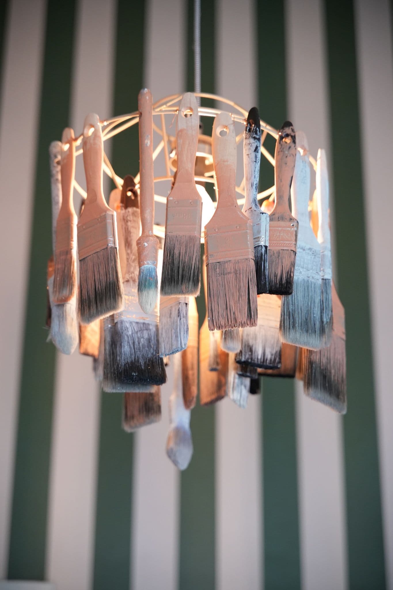 A bespoke paintbrush chandelier that Sophie created for the upstairs space.