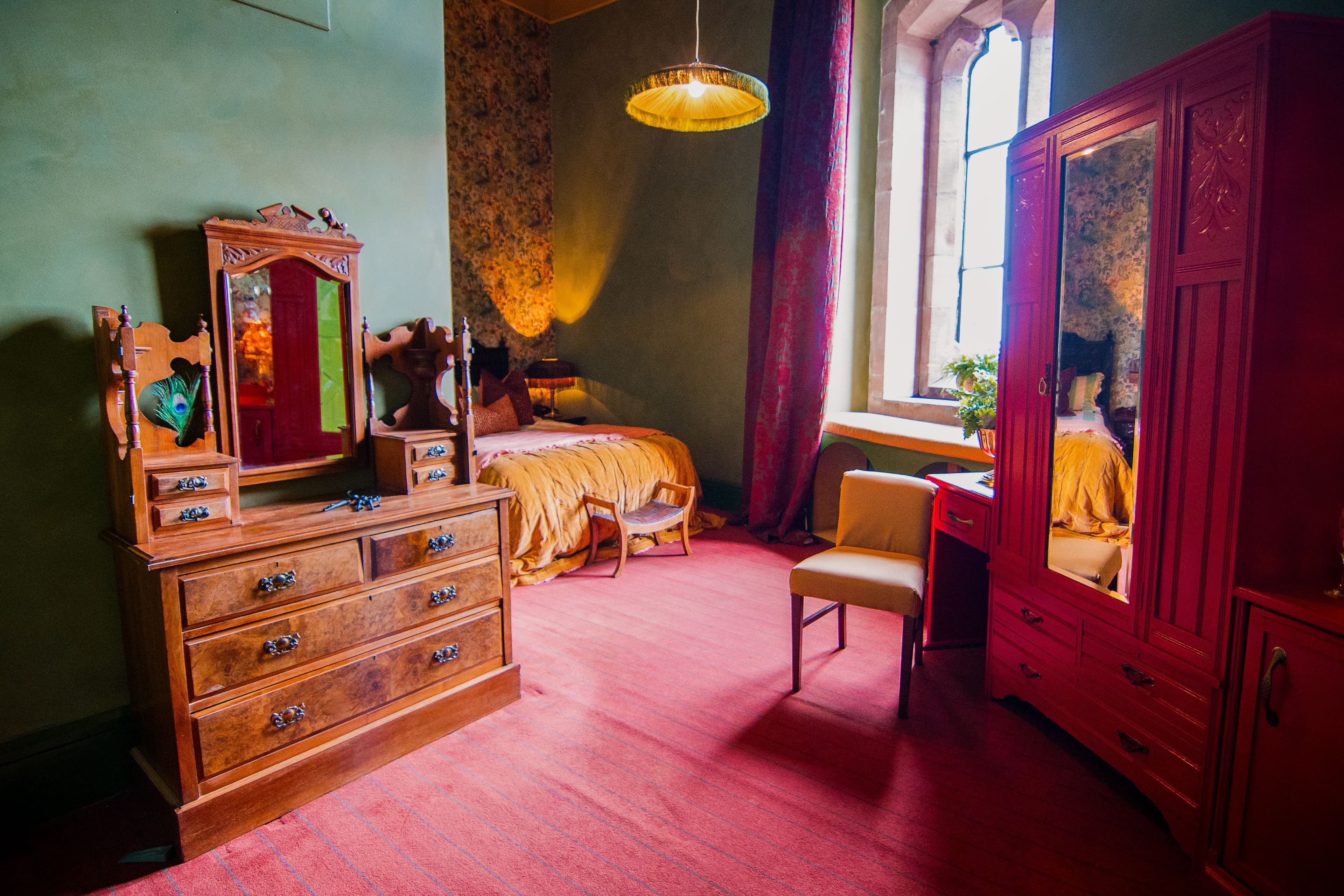 Additional storage brought in via a walnut dresser to allow guests ample storage